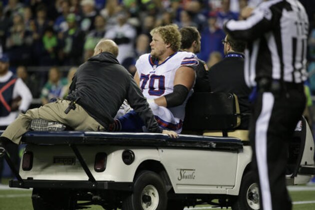 Buffalo Bills center Eric Wood is taken off the field on a card after an injury in the second half of an NFL football game against the Seattle Seahawks, Monday, Nov. 7, 2016, in Seattle. (AP Photo/Elaine Thompson)