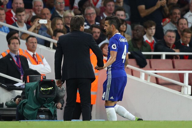 LONDON, ENGLAND - SEPTEMBER 24: Cesc Fabregas of Chelsea (R) speaks to Antonio Conte, Manager of Chelsea (L) after being subbed during the Premier League match between Arsenal and Chelsea at the Emirates Stadium on September 24, 2016 in London, England.  (Photo by Paul Gilham/Getty Images)