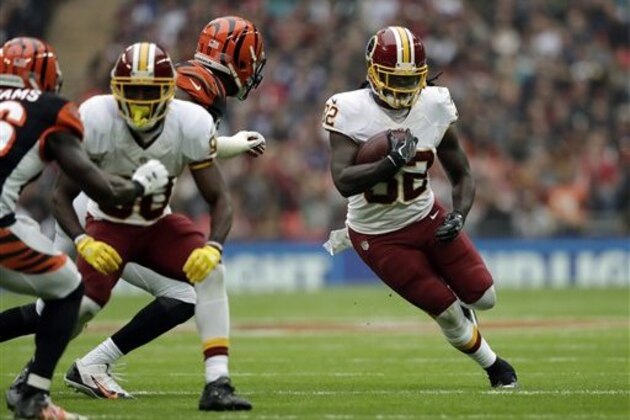 Washington Redskins running back Rob Kelley (32) runs with the ball during an NFL Football game between Cincinnati Bengals and Washington Redskins at Wembley Stadium in London, Sunday Oct. 30, 2016. (AP Photo/Tim Ireland)