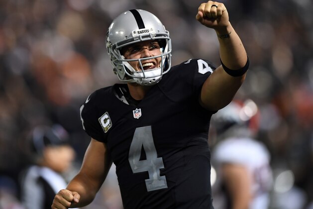 OAKLAND, CA - NOVEMBER 06:   Derek Carr #4 of the Oakland Raiders celebrates after a touchdown during the fourth quarter against the Denver Broncos at Oakland-Alameda County Coliseum on November 6, 2016 in Oakland, California. (Photo by Thearon W. Henderson/Getty Images)