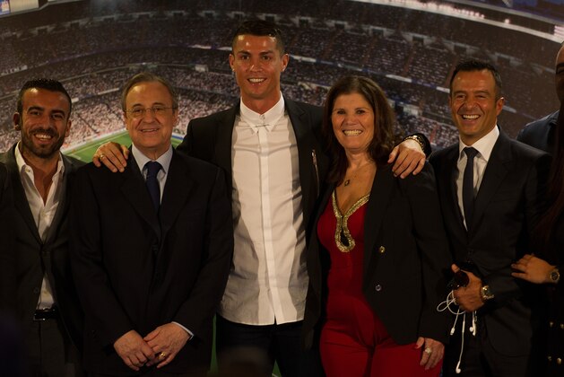 MADRID, SPAIN - NOVEMBER 07:  Cristiano Ronaldo of Real Madrid is joined by his mother Maria Dolores dos Santos Aveiro and club President Florentino Perez (L), and his agent Jorge Mendez (R) following his press conference after signing a new five-year contract with the Spanish club at the Santiago Bernabeu stadium on November 7, 2016 in Madrid, Spain.  (Photo by Denis Doyle/Getty Images)
