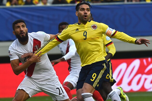Peru's midfielder Josepmir Ballon (L) and Colombia's forward Radamel Falcao Garcia wait for a ball during their 2015 Copa America football championship match, in Temuco, on June 21, 2015.    AFP PHOTO / RODRIGO ARANGUA        (Photo credit should read RODRIGO ARANGUA/AFP/Getty Images)