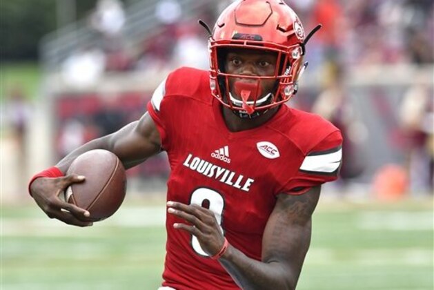 Louisville quarterback Lamar Jackson (8) looks for an opening as he runs the ball during action an NCAA college football game, Saturday, Sep. 17, 2016 in Louisville Ky. (AP Photo/Timothy D. Easley)