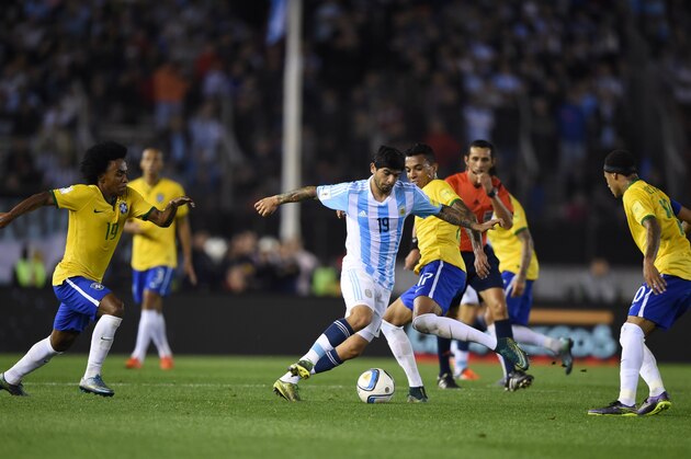 Argentina's Ever Banega (C) controls the ball next to Brazil's Luiz Gustavo during their Russia 2018 FIFA World Cup South American Qualifiers football match, in Buenos Aires, on November 13, 2015.  AFP PHOTO / EITAN ABRAMOVICH        (Photo credit should read EITAN ABRAMOVICH/AFP/Getty Images)