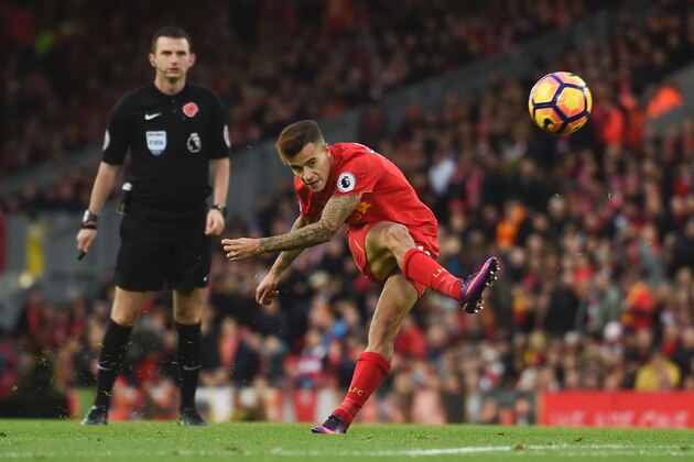 Liverpool's Brazilian midfielder Philippe Coutinho attempts a shot at goal during the English Premier League football match between Liverpool and Watford at Anfield in Liverpool, north west England on November 6, 2016. / AFP / PAUL ELLIS / RESTRICTED TO EDITORIAL USE. No use with unauthorized audio, video, data, fixture lists, club/league logos or 'live' services. Online in-match use limited to 75 images, no video emulation. No use in betting, games or single club/league/player publications.  /         (Photo credit should read PAUL ELLIS/AFP/Getty Images)