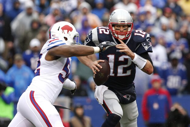 Oct 30, 2016; Orchard Park, NY, USA; Buffalo Bills inside linebacker Preston Brown (52) sacks New England Patriots quarterback Tom Brady (12) during the first half at New Era Field. Mandatory Credit: Kevin Hoffman-USA TODAY Sports