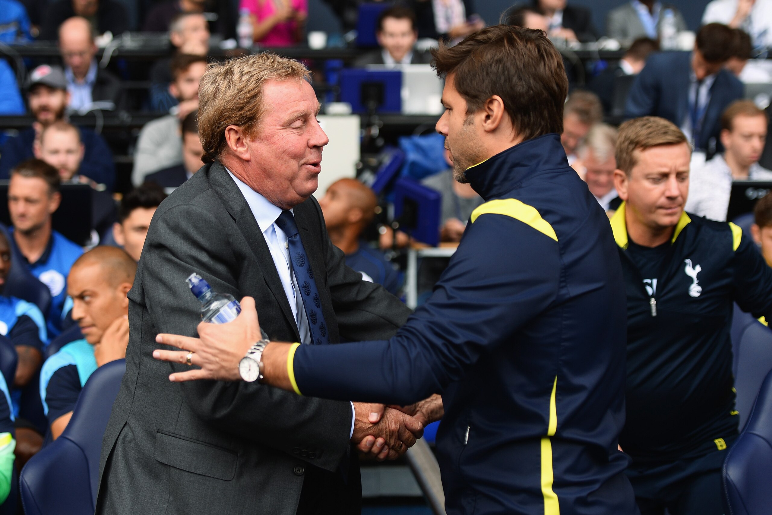 LONDON, ENGLAND - AUGUST 24: Harry Redknapp (L), the QPR manager shakes hands with Mauricio Pochettino, the Spurs manager prior to the Barclays Premier League match between Tottenham Hotspur and Queens Park Rangers at White Hart Lane on August 24, 2014 in London, England.  (Photo by Jamie McDonald/Getty Images)