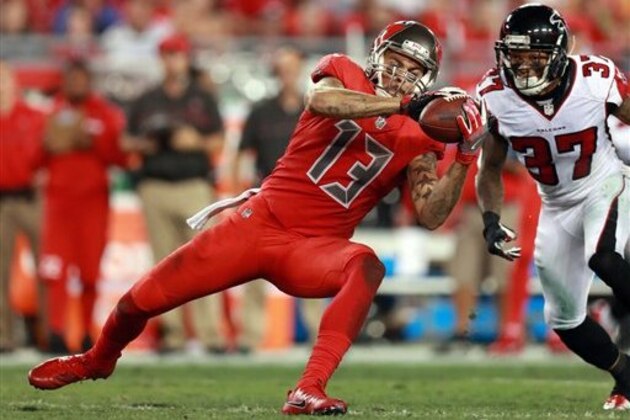 Tampa Bay Buccaneers wide receiver Mike Evans (13) makes a catch as Atlanta Falcons safety Ricardo Allen (37) tries to defend during an NFL football game Thursday, Nov. 3, 2016, in Tampa, Fla. (Jeff Haynes/AP Images for Panini)