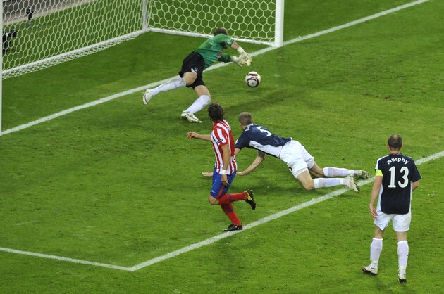 Atletico Madrid's Uruguayan forward Diego Forlan scores during the final football match of the UEFA Europa League Fulham FC vs Aletico Madrid in Hamburg, northern Germany on May 12, 2010. AFP PHOTO / NIGEL TREBLIN (Photo credit should read NIGEL TREBLIN/AFP/Getty Images)