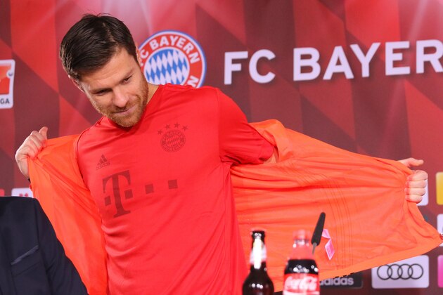 MUNICH, GERMANY - NOVEMBER 04:  In this handout image provided by FC Bayern Muenchen Xabi Alonso presents a new recycled ocean kit on November 4, 2016 in Munich, Germany.  The jersey is made out of ocean plastic, fibres from recycled plastic found in costal areas of the Maledives.  (Photo by FC Bayern via Getty Images)