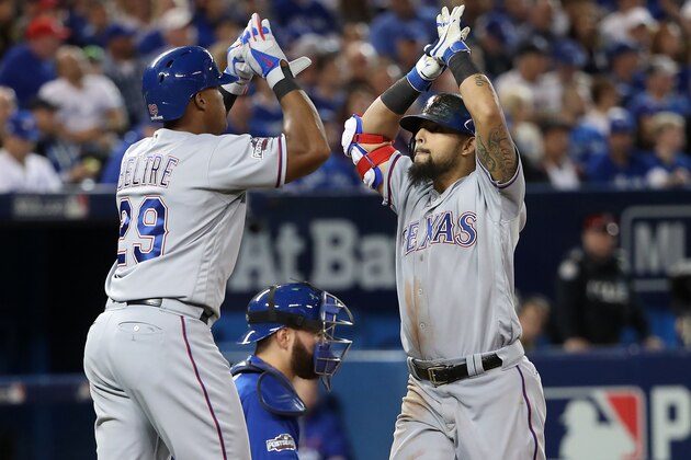 TORONTO, ON - OCTOBER 9: Rougned Odor #12 of the Texas Rangers celebrates with teammate Adrian Beltre #29 after hitting a two run home run against the Toronto Blue Jays in the fourth inning during game three of the American League Division Series at Rogers Centre on October 9, 2016 in Toronto, Canada. (Photo by Tom Szczerbowski/Getty Images)