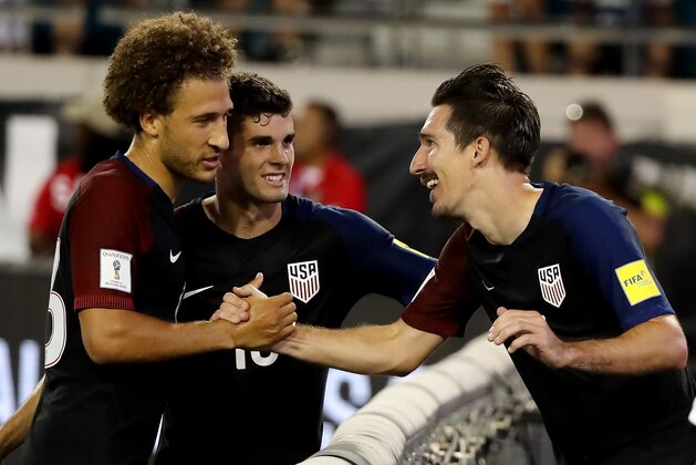 JACKSONVILLE, FL - SEPTEMBER 06:  Sacha Kljestan #16 of the United States (R) is congratulated by Christian Pulisic #10 and Fabian Johnson #23 following a goal during the FIFA 2018 World Cup Qualifier against Trinidad &Tobago at EverBank Field on September 6, 2016 in Jacksonville, Florida.  (Photo by Sam Greenwood/Getty Images)