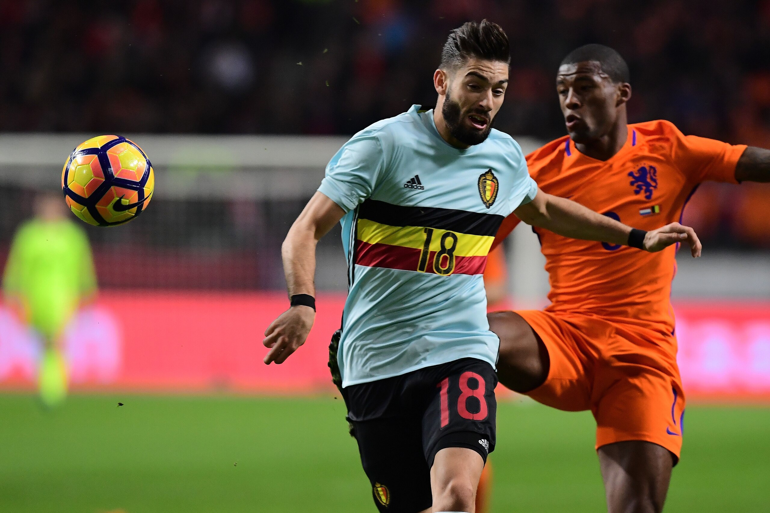 Belgium's midfielder Yannick Ferreira-Carrasco (Front) and Netherlands' midfielder Georginio Wijnaldum vie for the ball during a friendly football match between The Netherlands and Belgium at the Amsterdam Arena in Amsterdam on November 9, 2016. / AFP / EMMANUEL DUNAND (Photo credit should read EMMANUEL DUNAND/AFP/Getty Images) Belgium's midfielder Yannick Ferreira-Carrasco (Front) and Netherlands' midfielder Georginio Wijnaldum vie for the ball during a friendly football match between The Netherlands and Belgium at the Amsterdam Arena in Amsterdam on November 9, 2016. / AFP / EMMANUEL DUNAND (Photo credit should read EMMANUEL DUNAND/AFP/Getty Images)
