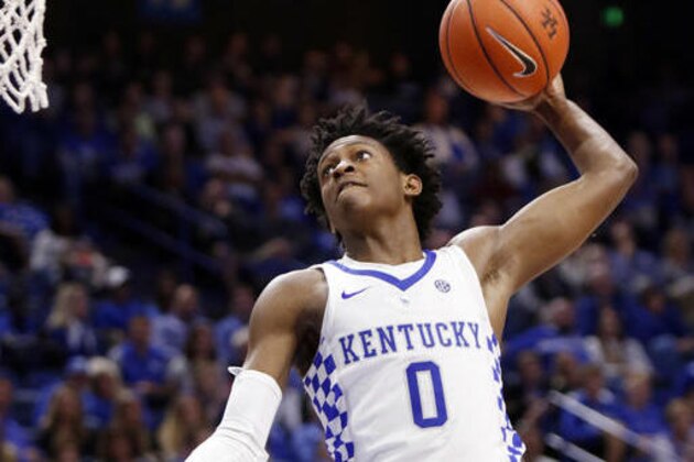 FILE - In this Nov. 6, 2016, file photo, Kentucky's De'Aaron Fox goes up for a dunk during the second half of an NCAA college basketball exhibition game against Asbury, in Lexington, Ky. Kentucky’s John Calipari landed five of the nation’s top 24 prospects according to composite rankings of recruiting websites compiled by 247Sports. The new Wildcats include guards De’Aaron Fox, Malik Monk, Bam Adebayo, Wenyen Gabriel and Sacha Killeya-Jones. (AP Photo/James Crisp, File)