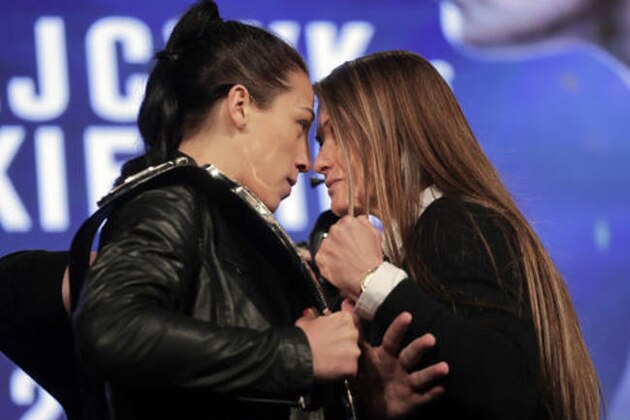 Strawweight champion Joanna Jedrzejczyk, left, faces off with Karolina Kowalkiewicz during a news conference for UFC 205 , Tuesday, Sept. 27, 2016, in New York. Jedrzeczyk and Kowalkiewicz are on the first UFC card to be held in New York after the state legislature legalized the sport earlier this year. UFC 205 will be held at Madison Square Garden on Nov. 12. (AP Photo/Julie Jacobson)