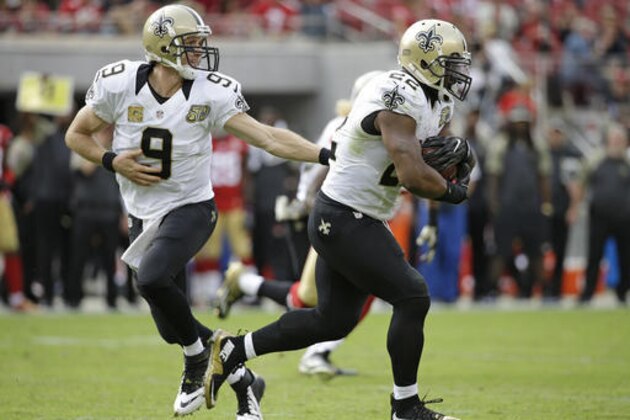 New Orleans Saints quarterback Drew Brees, left, hands off the ball to New Orleans Saints running back Mark Ingram, right, who rushes with the ball for a 75-yard touchdown during the first half of an NFL football game against the San Francisco 49ers, Sunday, Nov. 6, 2016, in Santa Clara, Calif. (AP Photo/Tony Avelar)