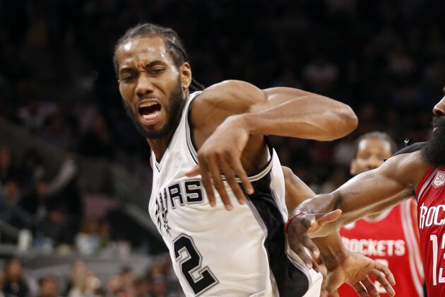 Nov 9, 2016; San Antonio, TX, USA; Houston Rockets shooting guard James Harden (13) drives to the basket while guarded by San Antonio Spurs small forward Kawhi Leonard (2) during the second half at AT&T Center. The rockets won 101-99. Mandatory Credit: Soobum Im-USA TODAY Sports