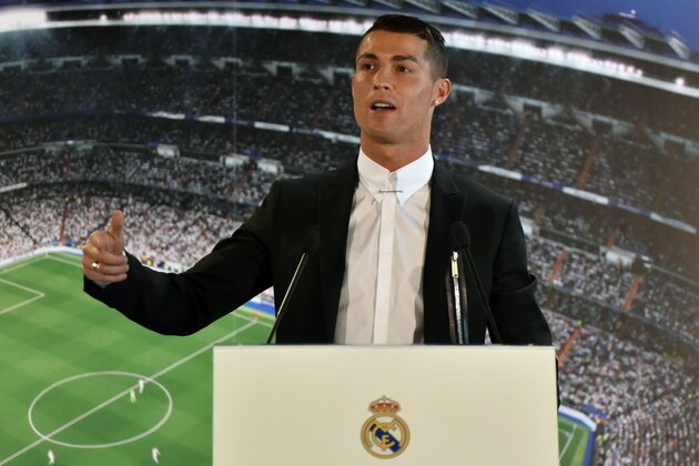 Real Madrid's Portuguese forward Cristiano Ronaldo a speaks during the official presentation of his contract renewal, in the presidential box at the Santiago Bernabeu stadium in Madrid on November 7, 2016. 
Real Madrid and Cristiano Ronaldo have agreed an extension to the player's contract, keeping him at the club until the 30th of June 2021. / AFP / GERARD JULIEN        (Photo credit should read GERARD JULIEN/AFP/Getty Images)