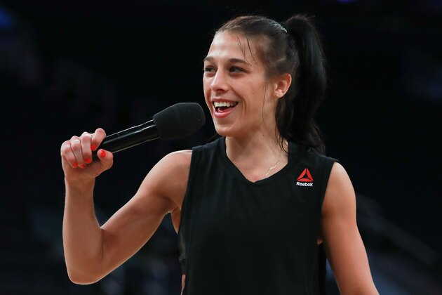 NEW YORK, NY - NOVEMBER 09:  UFC Women's Strawweight Champion Joanna Jedrzejczyk talks to the crowd during UFC 205 Open Workouts at Madison Square Garden on November 9, 2016 in New York City.  (Photo by Michael Reaves/Getty Images)