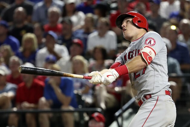 Sep 21, 2016; Arlington, TX, USA;  Los Angeles Angels center fielder Mike Trout (27) hits a three run home run during the fifth inning against the Texas Rangers at Globe Life Park in Arlington. Mandatory Credit: Kevin Jairaj-USA TODAY Sports