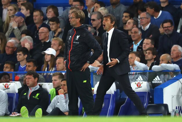 LONDON, ENGLAND - SEPTEMBER 16: Antonio Conte, Manager of Chelsea and Jurgen Klopp, Manager of Liverpool look on from the touchline during the Premier League match between Chelsea and Liverpool at Stamford Bridge on September 16, 2016 in London, England.  (Photo by Clive Rose/Getty Images)