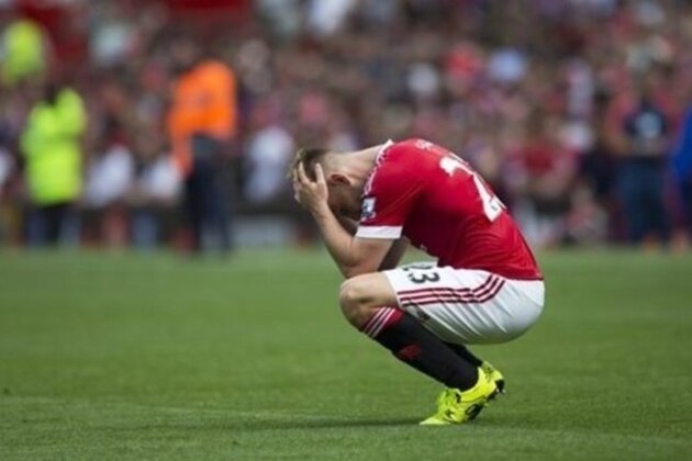 Manchester United's Luke Shaw reacts after his team's scoreless draw in the English Premier League soccer match between Manchester United and Newcastle at Old Trafford Stadium, Manchester, England, Saturday, Aug. 22, 2015. (AP Photo/Jon Super)