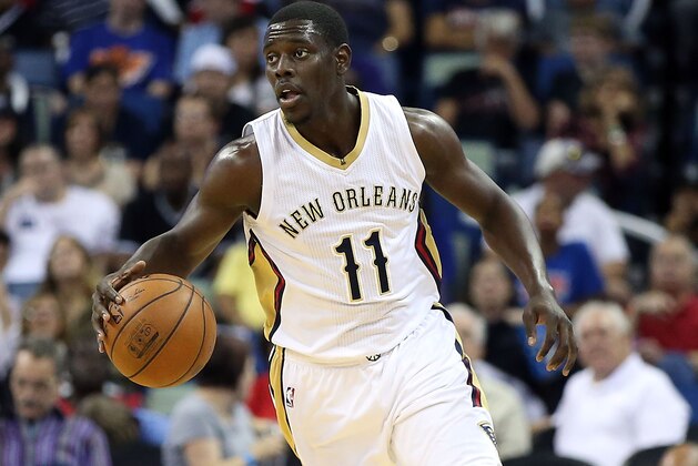 NEW ORLEANS, LA - MARCH 28:  Jrue Holiday #11 of the New Orleans Pelicans dribbles down the court during the first half against the New York Knicksat the Smoothie King Center on March 28, 2016 in New Orleans, Louisiana. NOTE TO USER: User expressly acknowledges and agrees that, by downloading and or using this photograph, User is consenting to the terms and conditions of the Getty Images License Agreement.  (Photo by Sean Gardner/Getty Images)