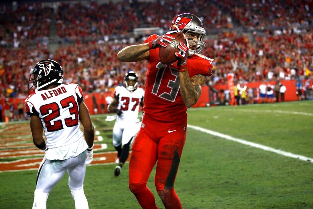TAMPA, FL - NOVEMBER 3:  Wide receiver Mike Evans comes down after hauling in a 24-yard touchdown pass from quarterback Jameis Winston in front of cornerback Robert Alford #23 of the Atlanta Falcons during the second quarter of an NFL game on November 3, 2016 at Raymond James Stadium in Tampa, Florida. (Photo by Brian Blanco/Getty Images)