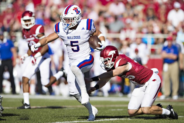 FAYETTEVILLE, AR - SEPTEMBER 3:  Trent Taylor #5 of the Louisiana Tech Bulldogs runs the ball during a game against the Arkansas Razorbacks at Razorback Stadium on September 3, 2016 in Fayetteville, Arkansas.  The Razorbacks defeated the Bulldogs 21-20.  (Photo by Wesley Hitt/Getty Images)