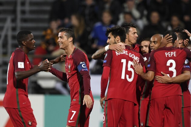 Portugal's forward Cristiano Ronaldo (2ndL) and teammates celebrate their goal during the WC 2018 football qualification match between Faroe Islands and Portugal in Torshavn on October 10, 2016.  / AFP / FRANCISCO LEONG        (Photo credit should read FRANCISCO LEONG/AFP/Getty Images)