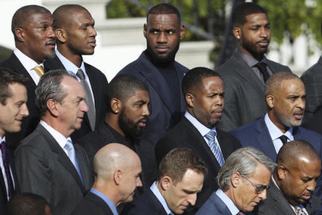 Cleveland Cavaliers  forward LeBron James, back center, poses with his Cavaliers teammates for a team pictures during a ceremony hosted by President Barack Obama honoring the 2016 NBA basketball champions, Thursday, Nov. 10, 2016. on the South Lawn of the White House in Washington.  (AP Photo/Manuel Balce Ceneta)