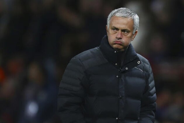 FILE - In this Thursday, Oct. 20, 2016 file photo, Manchester United's manager Jose Mourinho watches his team play a Europa League soccer match against Fenerbahce at Old Trafford stadium in Manchester, England. Manchester United manager Jose Mourinho has been banned for one game and fined 50,000 pounds ($61,000) on two misconduct charges. The punishments were announced Wednesday, Nov. 2, 2016 by the English Football Association.  (AP Photo/Dave Thompson, file)