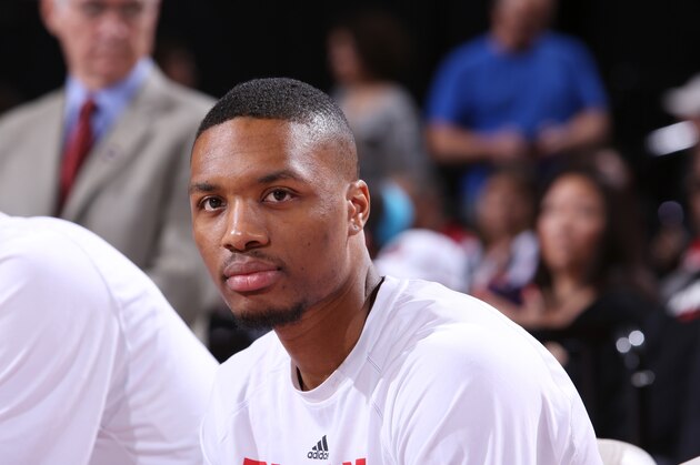PORTLAND, OR - APRIL 4: Damian Lillard #0 of the Portland Trail Blazers sits on the sideline before a game against the New Orleans Pelicans on April 4, 2015 at the Moda Center Arena in Portland, Oregon. NOTE TO USER: User expressly acknowledges and agrees that, by downloading and or using this photograph, user is consenting to the terms and conditions of the Getty Images License Agreement. Mandatory Copyright Notice: Copyright 2015 NBAE (Photo by Sam Forencich/NBAE via Getty Images)