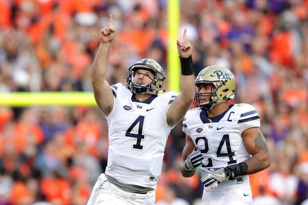 CLEMSON, SC - NOVEMBER 12: James Conner #24 of the Pittsburgh Panthers watches as teammate Nathan Peterman #4 celebrates after a touchdown pass against the Clemson Tigers during their game at Memorial Stadium on November 12, 2016 in Clemson, South Carolina.  (Photo by Streeter Lecka/Getty Images)