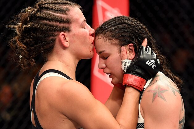 NEW YORK, NY - NOVEMBER 12:  Miesha Tate of the United States (left) embraces Raquel Pennington of the United States after her unanimous decision defeat in their women's bantamweight bout during the UFC 205 event at Madison Square Garden on November 12, 2016 in New York City.  (Photo by Jeff Bottari/Zuffa LLC/Zuffa LLC via Getty Images)