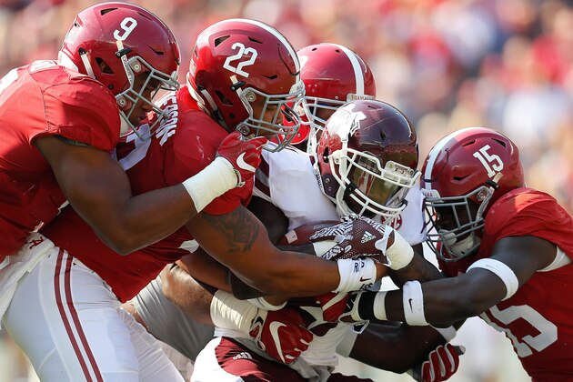 TUSCALOOSA, AL - NOVEMBER 12:  Aeris Williams #27 of the Mississippi State Bulldogs is tackled by Da'Shawn Hand #9, Ryan Anderson #22, Joshua Frazier #69 and Ronnie Harrison #15 of the Alabama Crimson Tide at Bryant-Denny Stadium on November 12, 2016 in Tuscaloosa, Alabama.  (Photo by Kevin C. Cox/Getty Images)