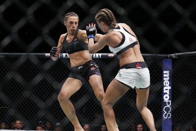 Nov 12, 2016; New York, NY, USA;  Joanna Jedrzejczyk (red gloves) fights against Karolina Kowalkiewicz (blue gloves) in their strawweight title bout during UFC 205 at Madison Square Garden. Mandatory Credit: Adam Hunger-USA TODAY Sports