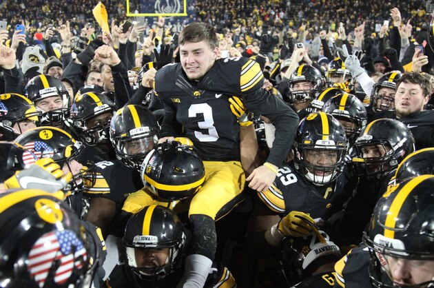 IOWA CITY, IOWA- NOVEMBER 12:  Kicker Keith Duncan #3 of the Iowa Hawkeyes is lifted in the air by teammates after kicking the winning field goal against the Michigan Wolverines on November 12, 2016 at Kinnick Stadium in Iowa City, Iowa.  (Photo by Matthew Holst/Getty Images)