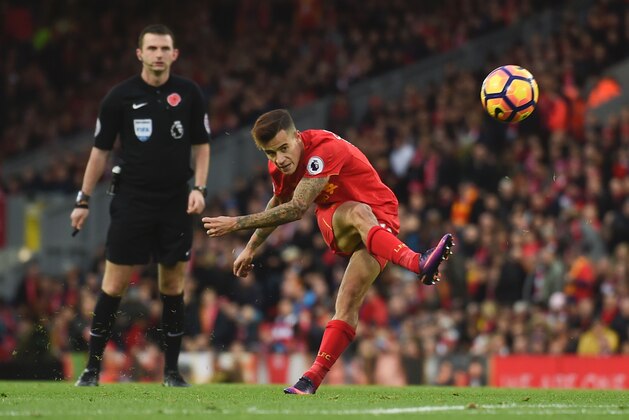 Liverpool's Brazilian midfielder Philippe Coutinho attempts a shot at goal during the English Premier League football match between Liverpool and Watford at Anfield in Liverpool, north west England on November 6, 2016. / AFP / PAUL ELLIS / RESTRICTED TO EDITORIAL USE. No use with unauthorized audio, video, data, fixture lists, club/league logos or 'live' services. Online in-match use limited to 75 images, no video emulation. No use in betting, games or single club/league/player publications.  /         (Photo credit should read PAUL ELLIS/AFP/Getty Images)
