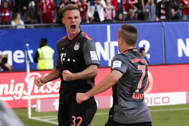Bayern's Joshua Kimmich, left, celebrates with Bayern's Franck Ribery after scoring his side's first goal during the German Bundesliga soccer match between Hamburger SV and FC Bayern Munich in Hamburg, Germany, Saturday, Sept. 24, 2016. (AP Photo/Markus Schreiber)