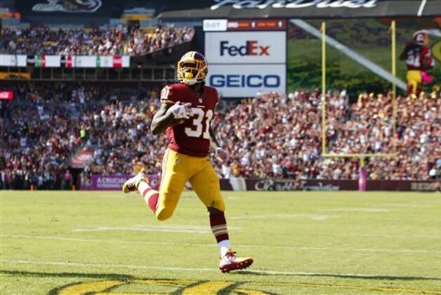 Washington Redskins running back Matt Jones scores a touchdown in the first half of an NFL football game against the Philadelphia Eagles, Sunday, Oct. 16, 2016, in Landover, Md. (AP Photo/Alex Brandon)