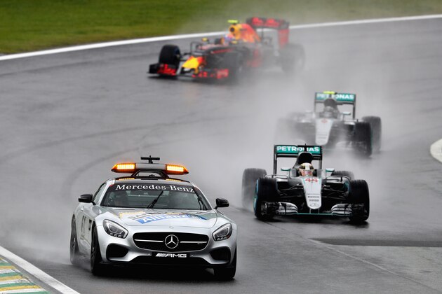 SAO PAULO, BRAZIL - NOVEMBER 13:  The safety car leads Lewis Hamilton of Great Britain driving the (44) Mercedes AMG Petronas F1 Team Mercedes F1 WO7 Mercedes PU106C Hybrid turbo and Nico Rosberg of Germany driving the (6) Mercedes AMG Petronas F1 Team Mercedes F1 WO7 Mercedes PU106C Hybrid turbo on track during the Formula One Grand Prix of Brazil at Autodromo Jose Carlos Pace on November 13, 2016 in Sao Paulo, Brazil.  (Photo by Clive Mason/Getty Images)