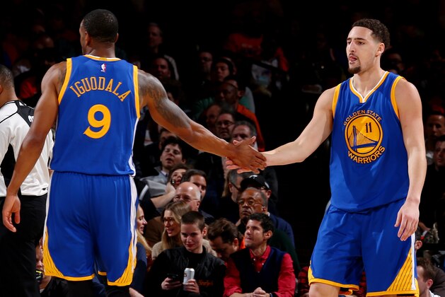 NEW YORK, NY - JANUARY 31:  Andre Iguodala #9 of the Golden State Warriors high fives Klay Thompson #11 of the Golden State Warriors during the game against the New York Knicks on January 31, 2016 at Madison Square Garden in New York City.  NOTE TO USER: User expressly acknowledges and agrees that, by downloading and or using this photograph, User is consenting to the terms and conditions of the Getty Images License Agreement. Mandatory Copyright Notice: Copyright 2016 NBAE  (Photo by Nathaniel S. Butler/NBAE via Getty Images)