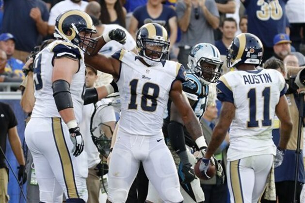 Los Angeles Rams wide receiver Kenny Britt, center, celebrates his touchdown with offensive guard Cody Wichmann, left, and wide receiver Tavon Austin during the second half of an NFL football game against the Carolina Panthers, Sunday, Nov. 6, 2016, in Los Angeles. (AP Photo/Ryan Kang)
