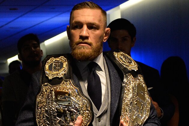 NEW YORK, NY - NOVEMBER 12:  UFC featherweight and lightweight champion Conor McGregor of Ireland enters the UFC 205 post fight press conference at Madison Square Garden on November 12, 2016 in New York City. (Photo by Brandon Magnus/Zuffa LLC/Zuffa LLC via Getty Images)