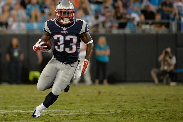 CHARLOTTE, NC - AUGUST 28:  Dion Lewis #33 of the New England Patriots runs against the Carolina Panthers during their preseason NFL game at Bank of America Stadium on August 28, 2015 in Charlotte, North Carolina.  (Photo by Grant Halverson/Getty Images)