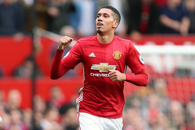 MANCHESTER, ENGLAND - SEPTEMBER 24: Chris Smalling of Manchester United celebrates after scoring a goal to make it 1-0 during the Premier League match between Manchester United and Leicester City at Old Trafford on September 24, 2016 in Manchester, England. (Photo by James Baylis - AMA/Getty Images)