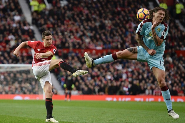 Manchester United's Spanish midfielder Ander Herrera (L) blasts the ball into Burnley's Irish midfielder Jeff Hendrick (R) during the English Premier League football match between Manchester United and Burnley at Old Trafford in Manchester, north west England, on October 29, 2016. / AFP / OLI SCARFF / RESTRICTED TO EDITORIAL USE. No use with unauthorized audio, video, data, fixture lists, club/league logos or 'live' services. Online in-match use limited to 75 images, no video emulation. No use in betting, games or single club/league/player publications.  /         (Photo credit should read OLI SCARFF/AFP/Getty Images)