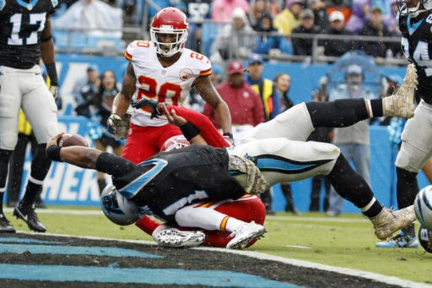 Carolina Panthers' Cam Newton (1) reaches over the goal line for a touchdown against the Kansas City Chiefs in the first half of an NFL football game in Charlotte, N.C., Sunday, Nov. 13, 2016. (AP Photo/Bob Leverone)