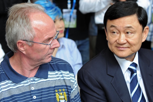 Manchester City owner Thaksin Shinawatra (R) sits next to team manager Sven-Goran Eriksson (L) during the opening ceremony of the ManCityStore in Bangkok on May 16, 2008. Embattled Manchester City manager Eriksson will have to wait at least another week before finding out if he still has a job according to City spokesman Paul Tyrrell who said on May 15, 2008 the club would be making no official comment other than confirming a review was being carried out into all aspects of the team's operation.  AFP PHOTO/Pornchai KITTIWONGSAKUL (Photo credit should read PORNCHAI KITTIWONGSAKUL/AFP/Getty Images)